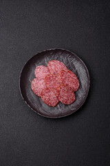 Sliced salami sausage, smoked meat, delicious deli snacks