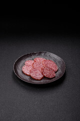 Sliced salami sausage, smoked meat, delicious deli snacks