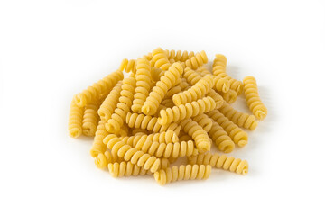 Uncooked fusilli pasta, top view . Close up view from above of an isolated portion of pasta on a white background . 