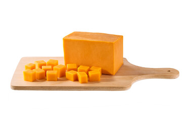 cheddar cheese sliced ​​into cubes on a cutting board isolated on a white background.