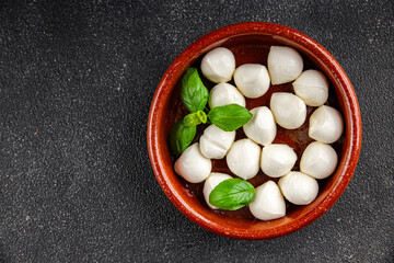 Mozzarella mini cheese balls dish fresh delicious gourmet food background on the table rustic food top view copy space