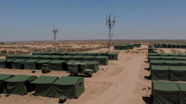 Deserted Military Base Surrounded by Arid Landscape under Clear Sky