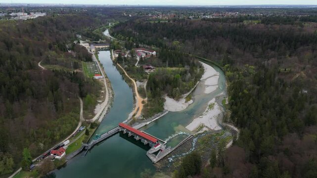 Aerial view of the VLH hydropower plant Baierbrunn at the Isar River, near Munich, Germany. Rest water energy, fish ladder, eco-friendly electricity, scenic landscape, renewable energy in Bavaria. 