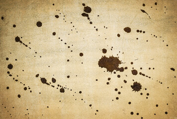 Ink splash over vintage paper, black watercolour splatter background..