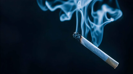 Burning Cigarette With Smoke Against Dark Background