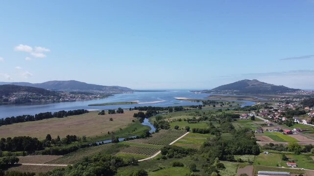 Aerial Drone View of River Mi&ntilde;o Estuary in Spring on a Sunny Day, Showing Both Spanish and Portuguese Shores - 1500
