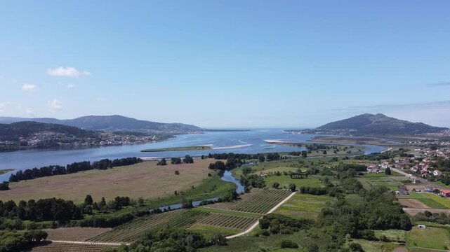 Aerial Drone View of Both Spanish and Portuguese Shores of River Mi&ntilde;o on a Sunny Day, Galicia, Spain - 1502

