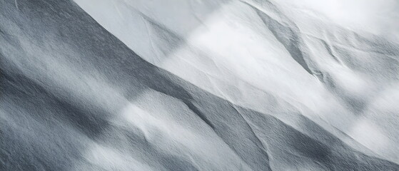 Textured Gray Surface with Dynamic Shadows and Soft Light Patterns