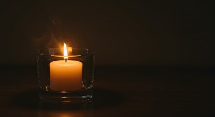 Warm Candlelight in a Glass Holder