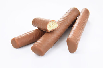 Chocolate praline long filled with milk cream isolated on white