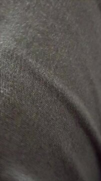 It emphasizes different textures, from soft and luxurious fabrics like silk to durable, wear-resistant material