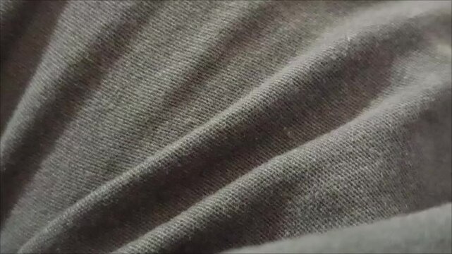 It emphasizes different textures, from soft and luxurious fabrics like silk to durable, wear-resistant material