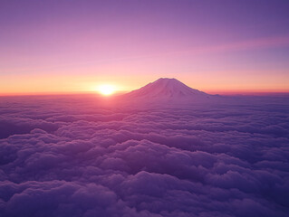 breathtaking view of a snow-covered mountain at sunset, with the sky painted in hues of pink and purple. The mountain peak is illuminated by the soft light of the setting sun