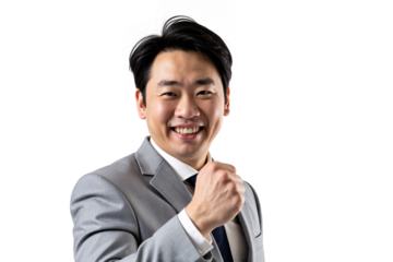 Confident East Asian businessman smiling while adjusting his necktie, wearing a grey suit, professional preparation portrait isolated against a transparent background for corporate use