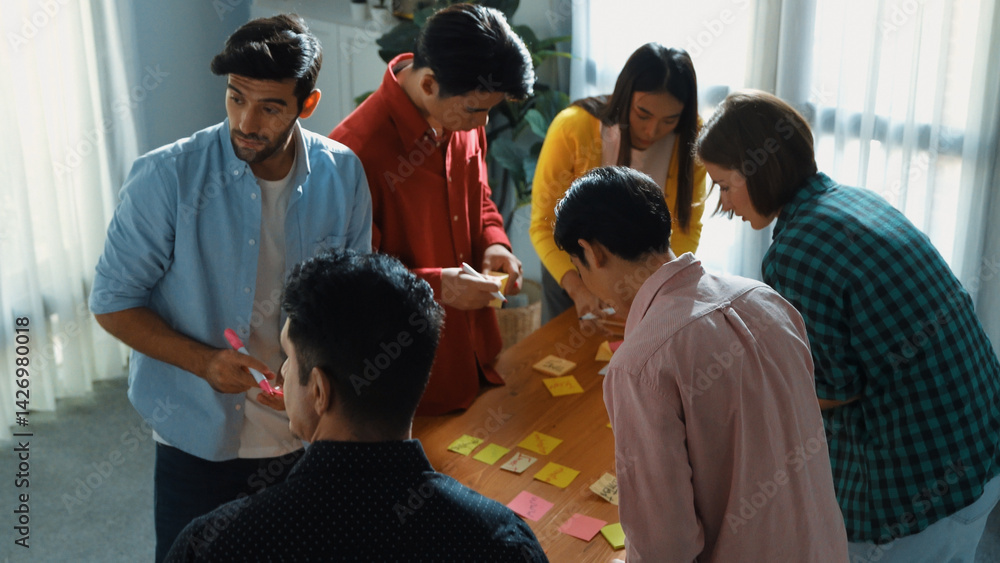 Poster top view of smart business team brainstorm idea while writing idea in colorful sticky notes. attract