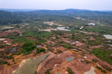 Illegal gold mining in a deforested area of ​​the Amazon rainforest. Huge mercury contamination in rivers and nature. Concept of deforestation, environment, ecology, global warming, climate change.