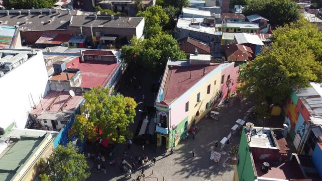 Tourists walking in caminito street in la boca neighborhood, buenos aires