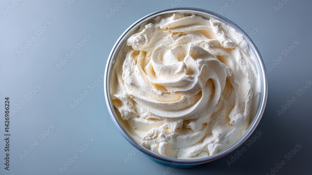 Poster Close-up view of thick, creamy vanilla yogurt showing a swirled texture in a round container, placed on a clean surface with subtle shadows highlighting freshness