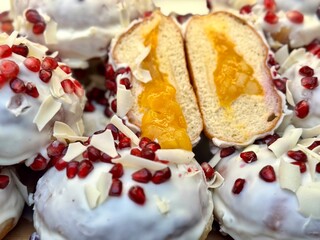 close-up of cream donuts with white icing
