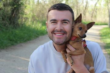 A handsome man and his small dog 