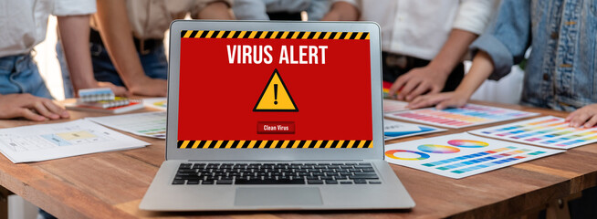 Virus warning alert on computer screen detected brisk cyber threat , hacker, computer virus and...