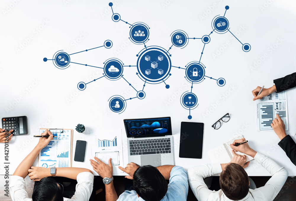 Aufkleber a group of business professionals is engaged in a collaborative effort analyzing data with technolog