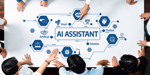 People collaborating around a table discuss the future of AI assistant technology, focusing on...