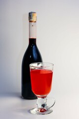 Wine bottle next to a glass of rose wine
