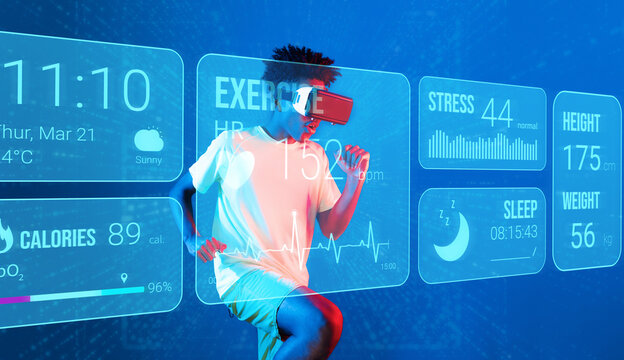 African man jogging or using augmented reality goggle and artificial intelligence practicing and training. Male model with shirt doing running posture and looking at hologram. Technology. Ingenuity.