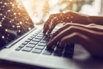 Person working on a laptop with a network graphic overlay. Hands typing on a keyboard, a modern technology image