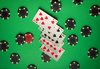 Cards depicting a full house or full boat combination are placed on a green felt surrounded by poker chips. The setting conveys the excitement of a casual gaming night with friends