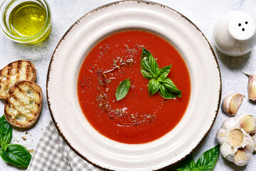 Gazpacho - cold spanish tomato soup with cucumber . Top view with copy space.