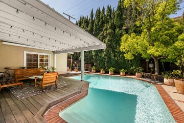 Charming single-story home with light-filled interiors, stylish kitchen, lush garden