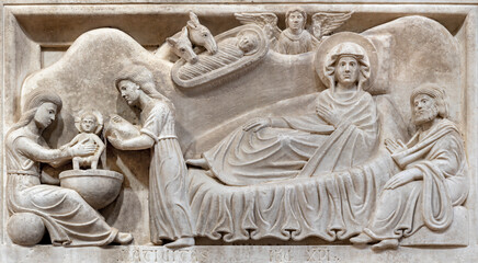 PISTOIA, ITALY - MARCH 16, 2025: The marble relief of Nativity in the church Chiesa di san Bartolomeo by Guido da Como from 13. cent.