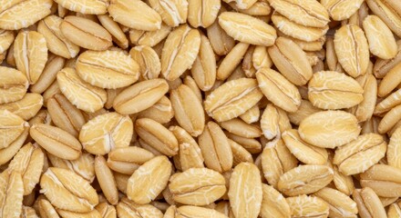 Macro close up full frame texture pattern of uncooked dried oat rolled into flake, view from top angle, concept healthy food and vegetarian meal