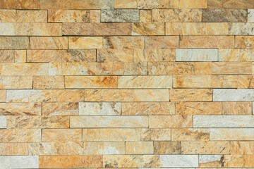 A beautifully crafted Textured Stone Wall featuring harmonious Earthy Tones that enhance any space
