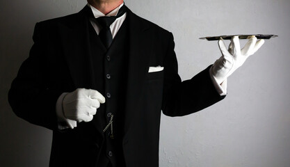 Butler or Formal Waiter in Black Suit and White Gloves Holding Serving Tray. Professional Hospitality and Service