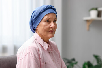 Portrait of senior woman with cancer at home