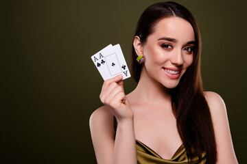 Photo of lovely girl poker player hold playing cards isolated green color background