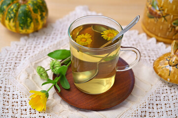 calendula tea on the table as an example of traditional medicine