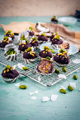 Artisan homemade fine dark chocolate pralines with pistachio and coconut chips