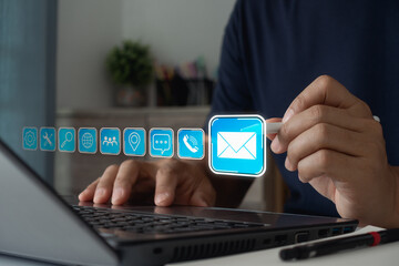 Contact us concept. Businessman using laptop to show the icon ( address, phone, email, call ) to contact customer support. Help from mail website digital technology of business contact service.