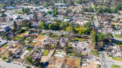 Aerial shot of fire damaged businesses and homes on Lake Street in Altadena California USA