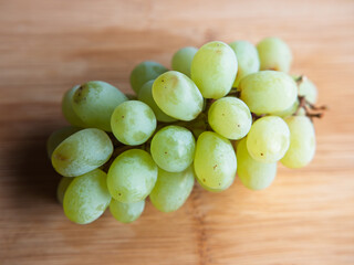 Fresh Green Grapes on a Wooden Cutting Board