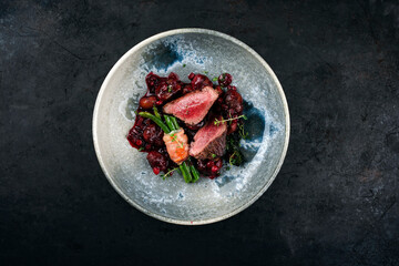 Traditionally roasted fillet of saddle of venison with chestnuts, bacon-wrapped bean sticks and...
