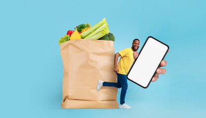 A customer holding a smartphone runs alongside a large paper bag filled with fresh groceries. The bright blue background emphasizes the convenience of shopping in today's new normal.