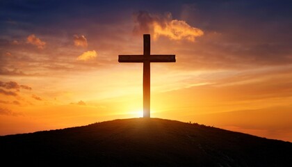 cross stands alone on a hill at orange sky christian background