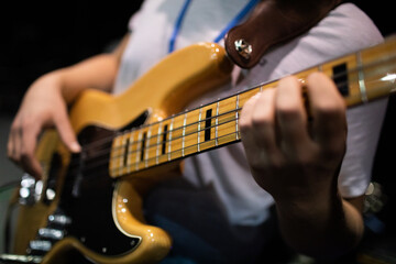 Fototapeta premium A CloseUp of an Electrifying Bass Guitar Performance During a Live Concert Event
