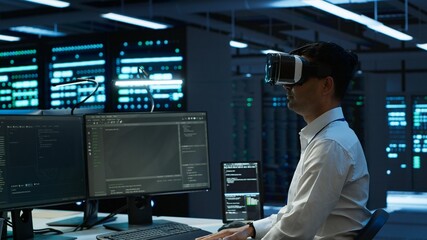 Admin in data center using virtual reality tech to ensure system can handle networking tasks. Server room worker wearing VR headset to track network traffic with PC, making improvements, camera A