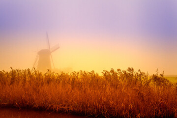 Dutch windmill in the mist